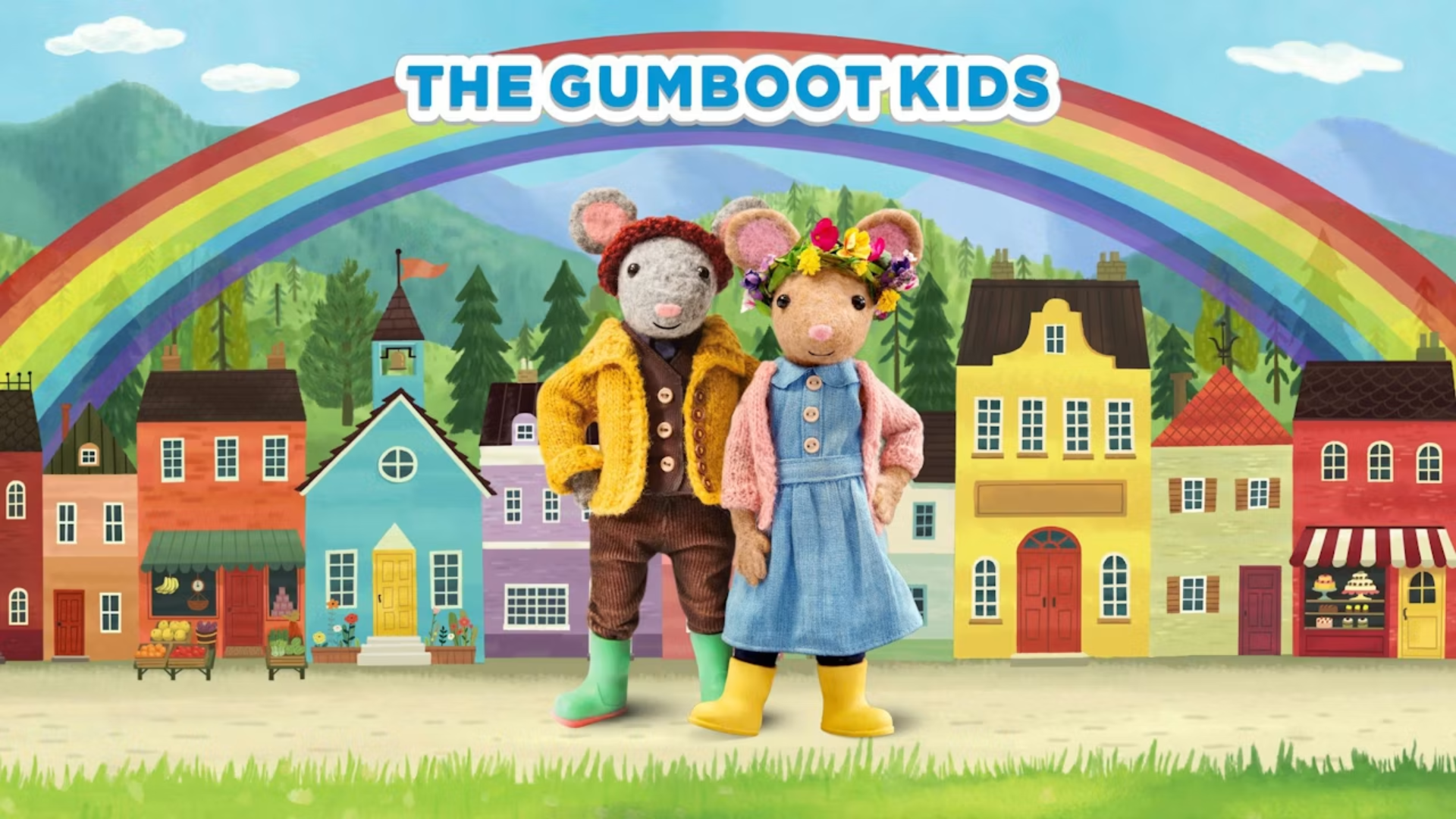 The Gumboot Kids title card showing felt mouse characters Scout and Daisy standing in front of a colorful village and rainbow — a gentle, nature-focused mindfulness show for toddlers on Yippee.